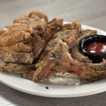 Side Street Inn signature dishes Pan-Fried Island Pork ChopsSide Street Inn Fried RiceLilikoi BBQ Baby Back RibsSizzling Boneless Kalbi